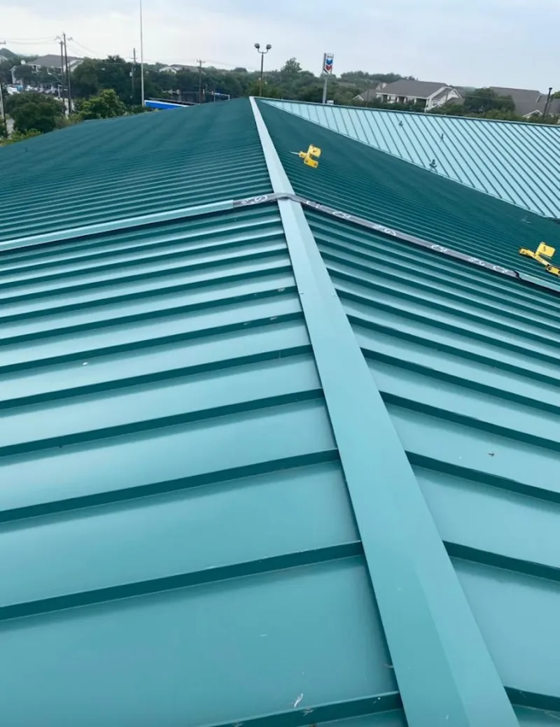 Green commercial metal roof ridge and valley for Metal Roof Repair in Menomonee Falls