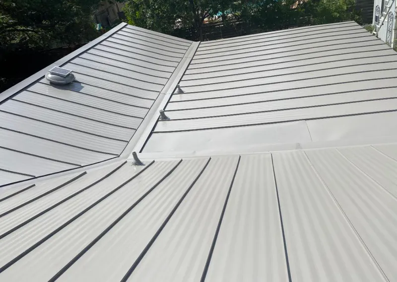 Solar attic fan installed on a metal roof for Roof Ventilation in Menomonee Falls